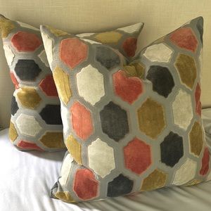 Two D.V. Kap 21” pillows in a beautiful gold, orange, gray and white pattern.